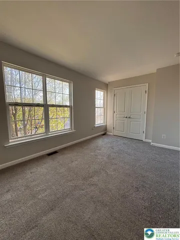 Second bedroom with double door closet.