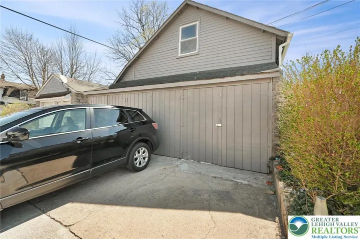 Detached 3 car garage - 3 bays/spots rented.