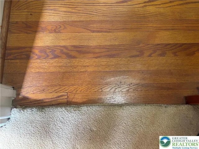 Hardwood flooring underneath all first-floor carpeting!!