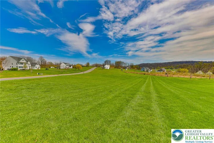 The large yard to the left of the house is also part of the property.