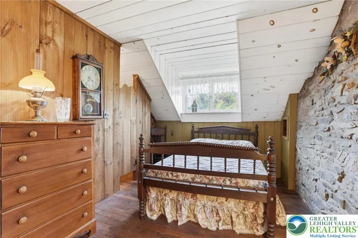 Wood floors, natural light, original stone walls