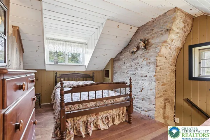 Wood floors, natural light, original stone walls