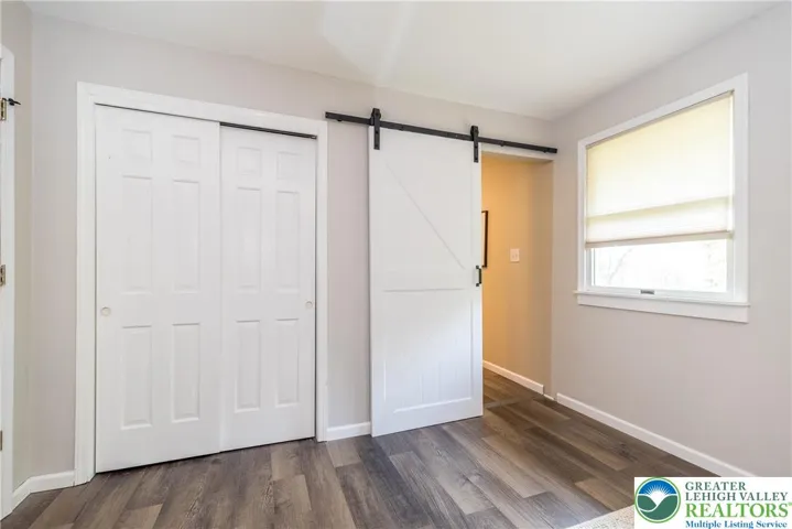 Barn door to private Primary Bathroom