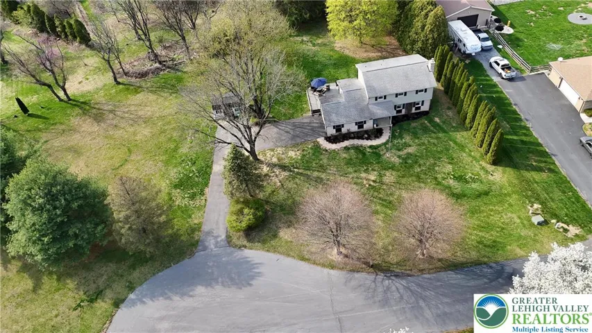 Aerial view shows tree-lined privacy