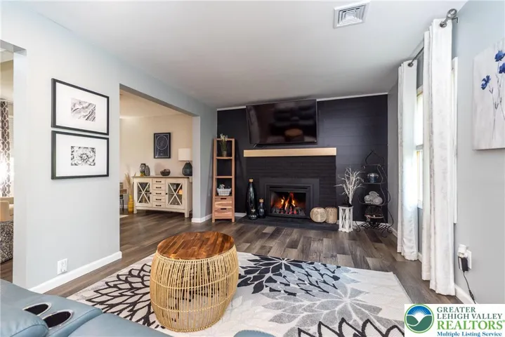 Stylish Living Room with shiplap and gas fireplace