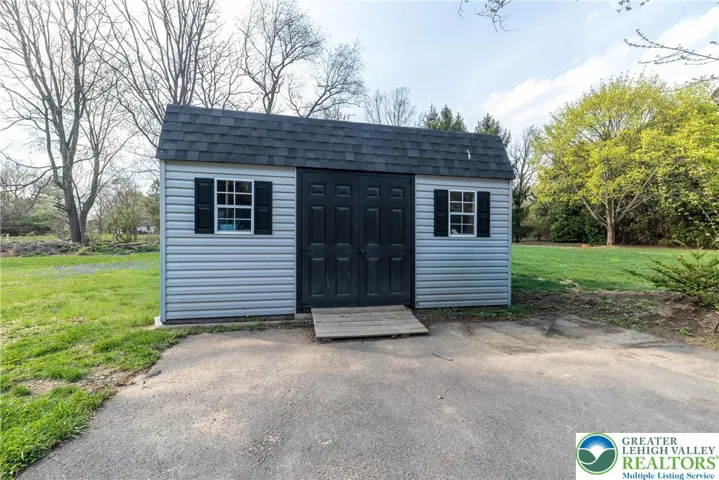 Shed for mower, tools, and toys
