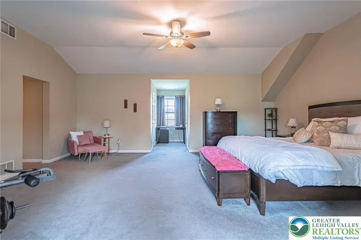 Primary bedroom with two walk-in closets