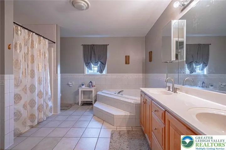Primary bathroom with shower and tub