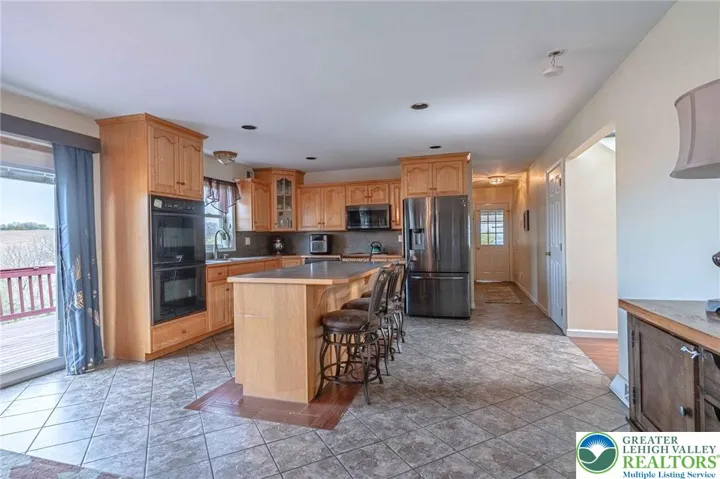 Kitchen into hallway towards mudroom and garage