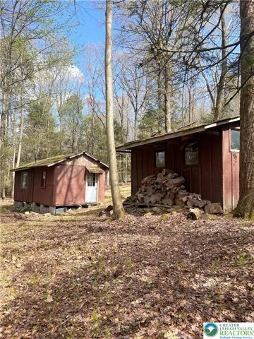 Detached garage alongside the cabin.