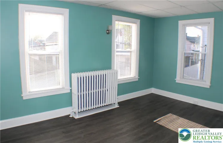 Front bedroom has tons of light and engineered hardwood