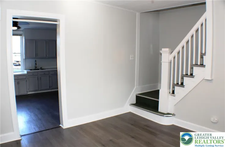 Dining room in the middle, kitchen at the rear of the home