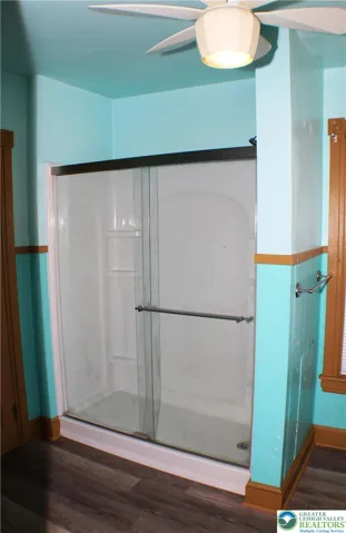 Full walk-in shower with glass doors