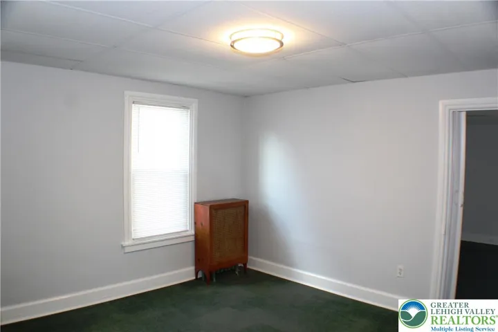 Middle bedroom has an overhead light