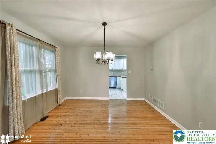 Dining area with hardwood flooring