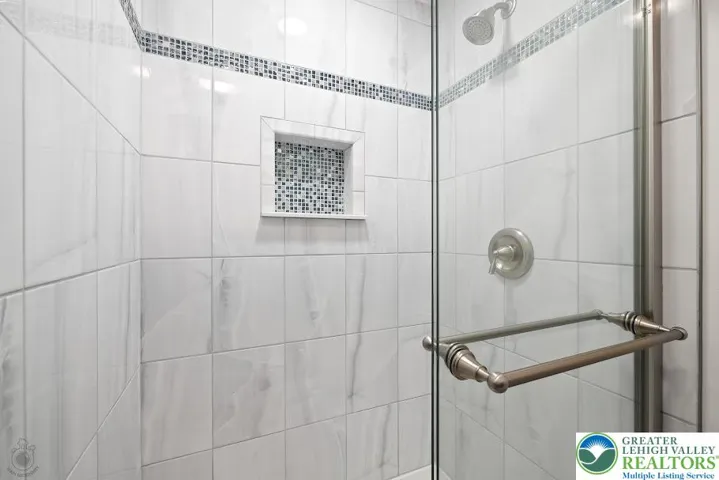 Lower Level Walk-In Shower w/ Custom Tile Shower.