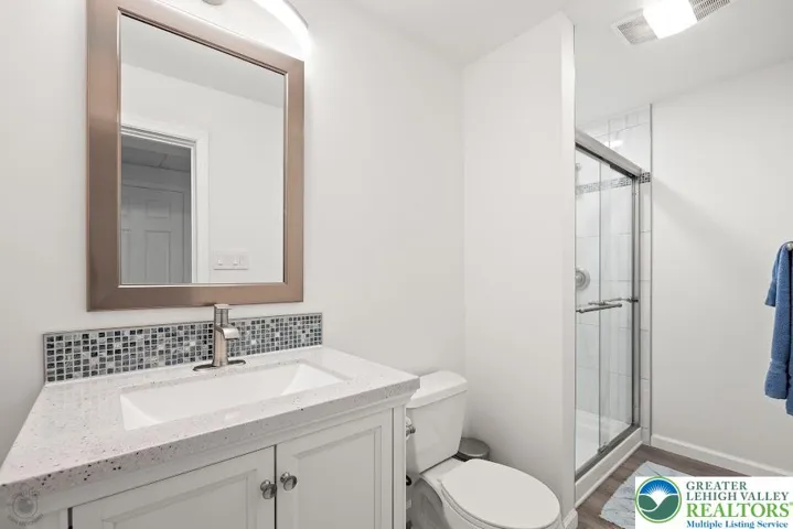 Lower Level Full Bath w/ Quart Vanity.