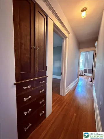 upstairs find more turn-of-the-century craftsmanship such as these deep hallway built-ins.