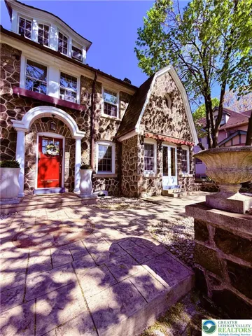 oversized garage in back leads to basement. Small utitily room with electric to the left.