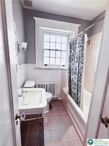 upstairs full bath features a bath/shower.