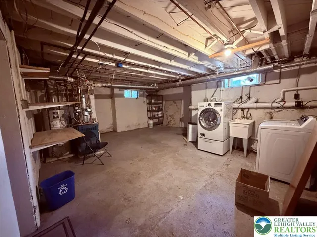 lower level offers much more space, laundry and garage/workshop areas.