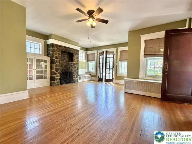 gracious living room/foyer with french doors to your fab front patio.