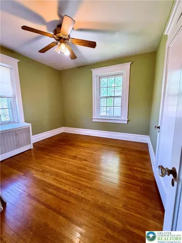 lovely bedrooms upstairs with original hardwood floors.