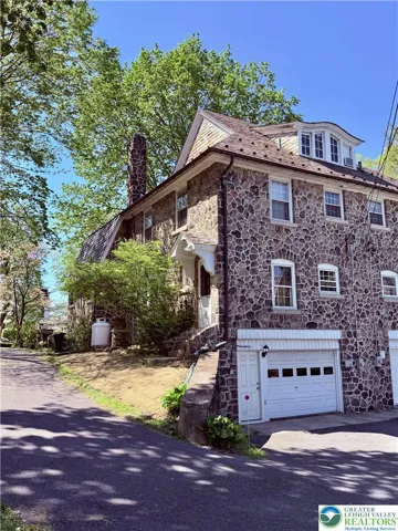 garage is out back on lower level and there's a handy side-door to the kitchen.