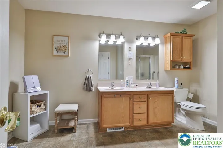 Master bath is very spacious with dual sinks and shower plus lots of storage for linen and towels