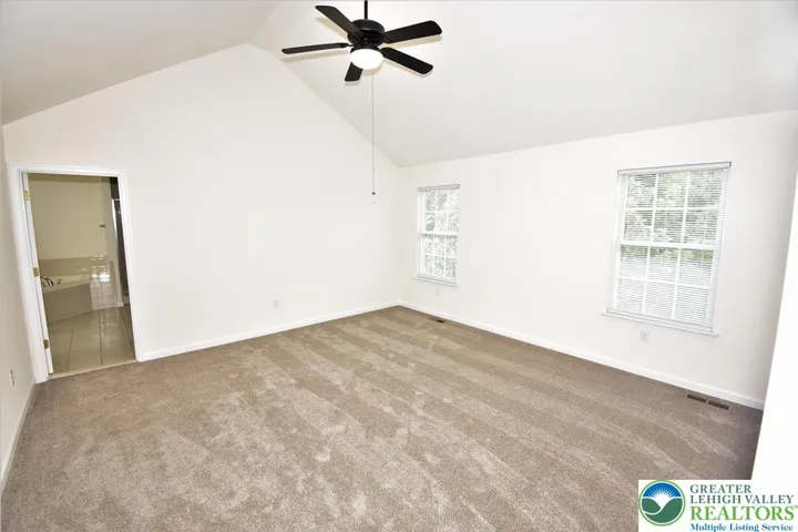 Master bedroom with vaulted ceilings