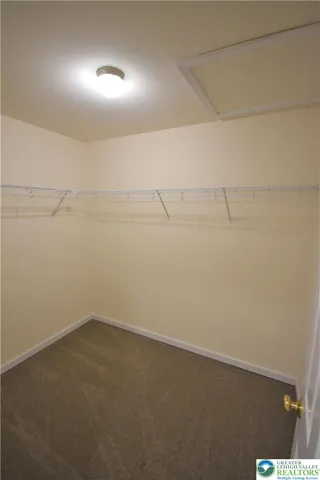 1 of 2 master bedroom walk in closets