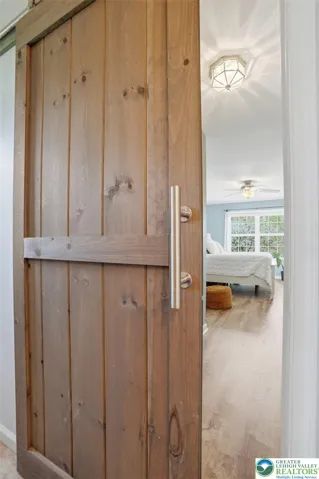 Sliding Barn Door Leading to Primary bath