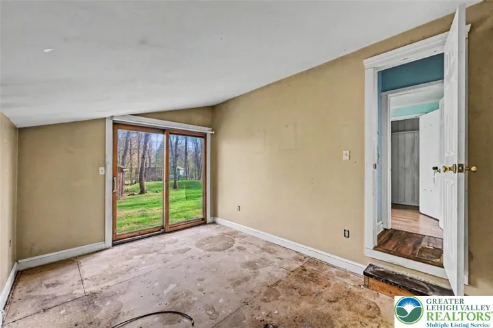 Bedroom 3 leads into the Primary Suite.
