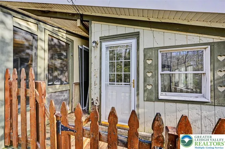Front deck leading to the Dining/Kitchen area and the screened in porch.
