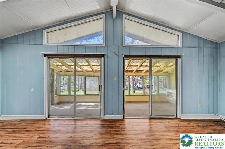 View of the double sliding doors with angled stationary windows in the Living Room--plenty of natural light.
