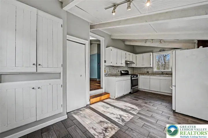 The Dining area features built-in cabinetry and a shallow storage closet.
