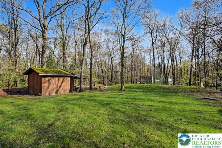 The back yard is flat--great for kids and pets and the septic was replaced in 2013.
