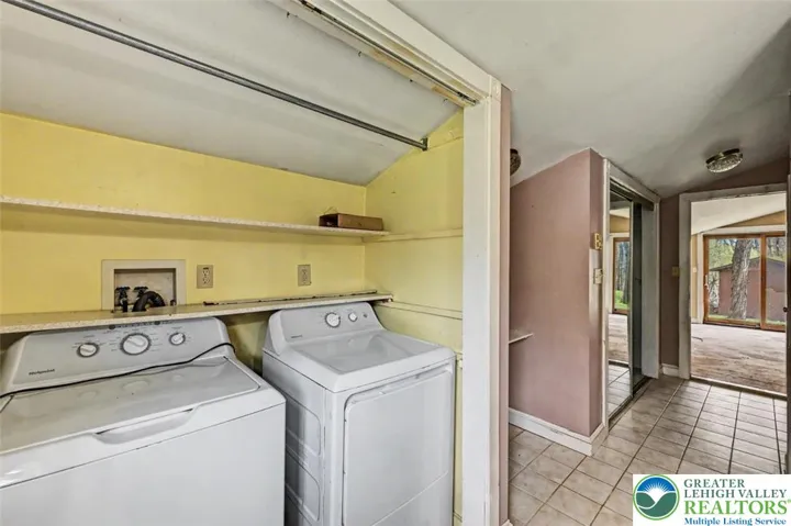 View of the laundry closet and make-up area in the Primary Bath.
