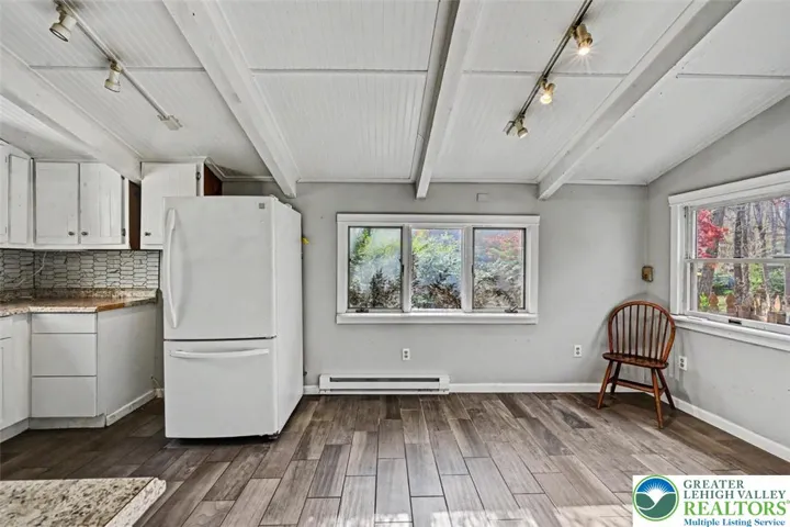 View of the Dining Area off the Eat-In Kitchen with window overlooking the side yard.
