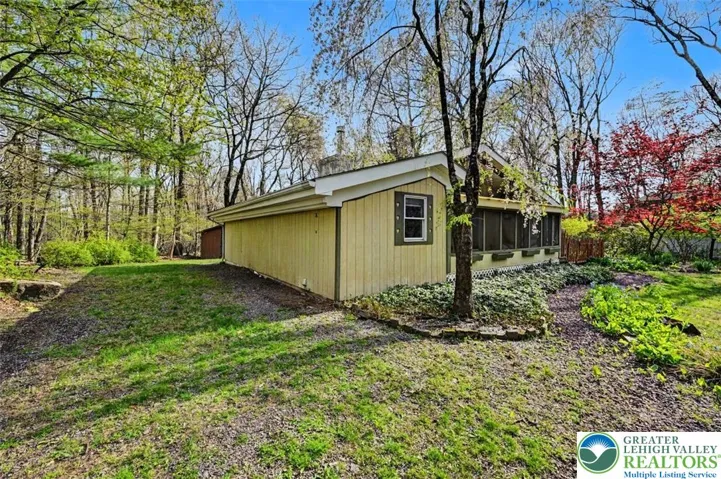 Sloped in the front, the property flattens out at the house and is flat throughout the back yard.

