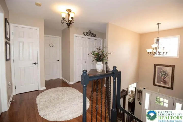 loft area has plenty of closet space and double doors to the laundry area