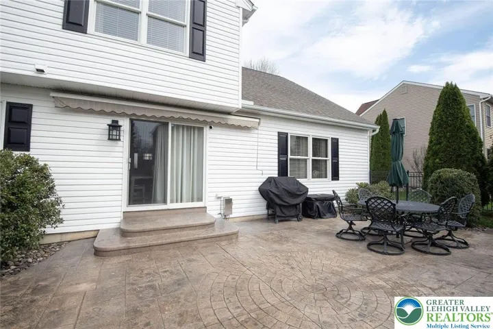 Paver patio adds to the charming landscaping and perfect for entertaining