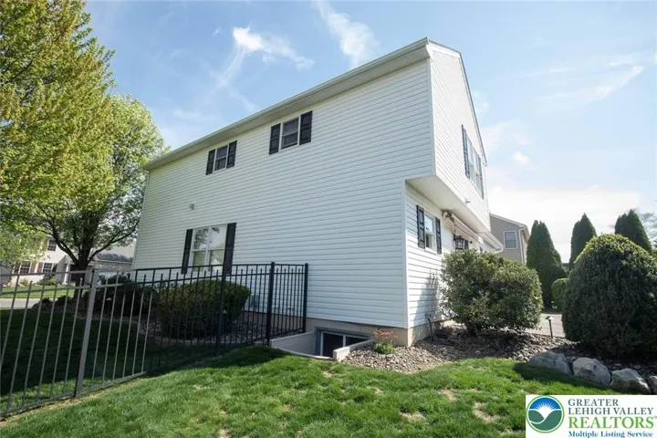fenced in side of home (view of lower level escape window)