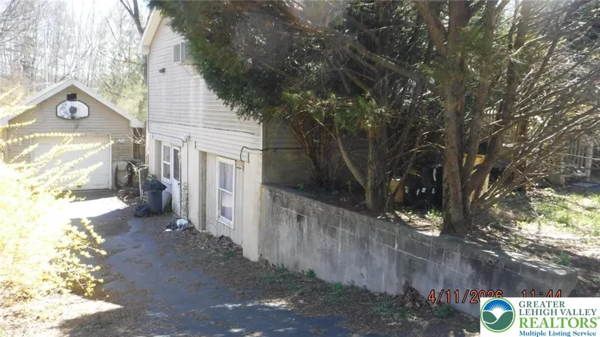 LEFT SIDE AND GARAGE