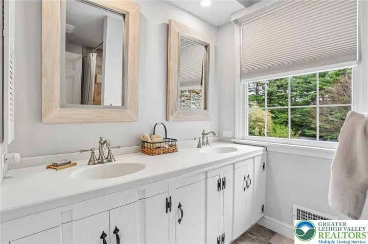 Guest hall Bathroom with dual sinks