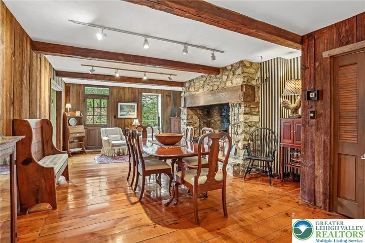 Wide plank flooring and stone fireplace