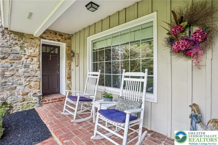 Covered front Porch entering to Foyer