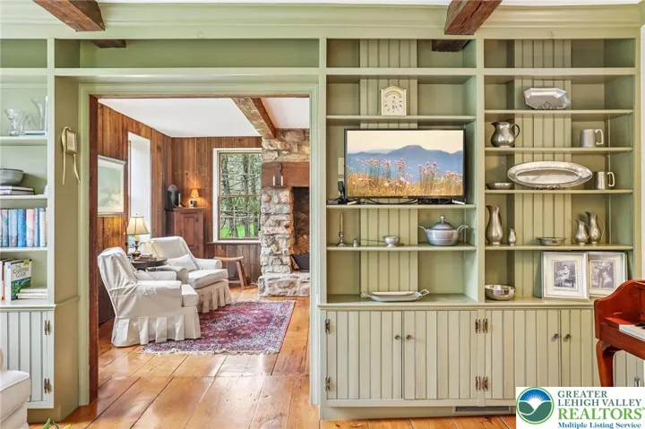 Built-in bookcases in formal Living room leading into Dining room