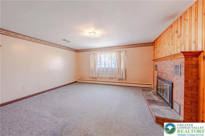 Family room with wood burning fireplace