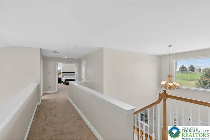 Open hallway overlooks family room